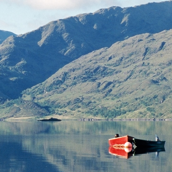 Zoom: The Arnisdale ferry at its moorings on a tranquil early morning, with our wee ‘Erratic & Fierce’ tied to its side