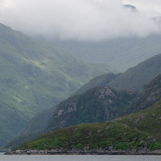 Zoom: Clouds churning around Sgurr a’ Mhaoraich behind fjord-like inner Loch Hourn; a bit of sunshine on Buidhe Bheinn