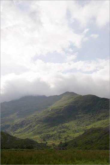 Sgurr a' Choire-bheithe under a cloud, over the ruins of Ambraigh at Barisdale