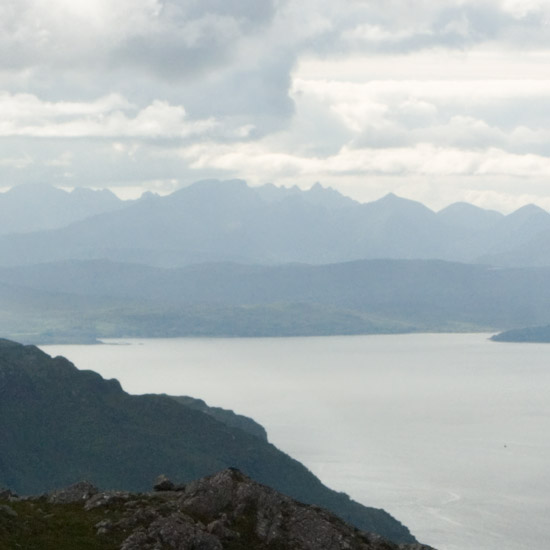 Zoom: Watching evening clouds from Meall nan Eun, over Loch Hourn and the mountains on the Isle of Skye